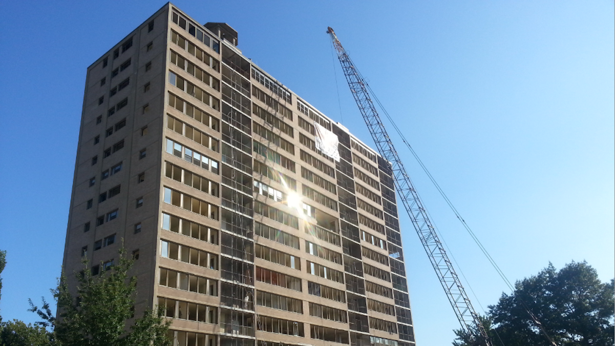  The sun reflects off a Queen Lane Apartments tower that is scheduled for implosion on Sept. 13. (Aaron Moselle/WHYY) 
