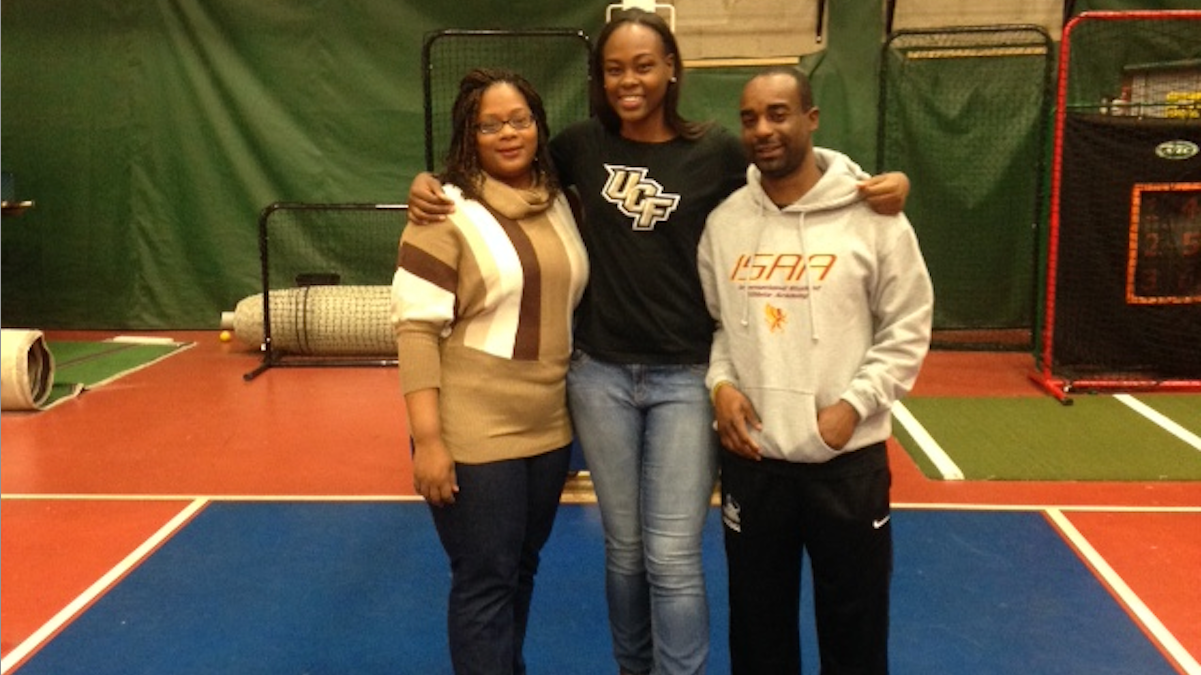  Kayla Thomas stands on the Mastery basketball court with her mother Keturah Thomas and coach Antowine Graham. (Desirae Holland/for NewsWorks) 