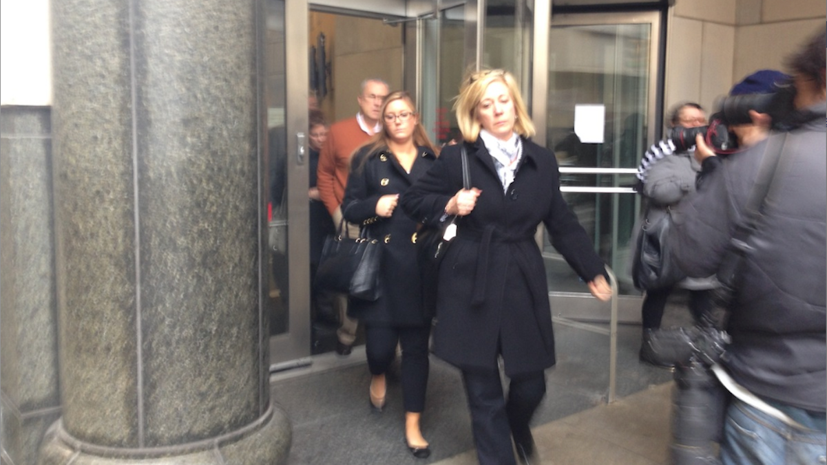  Kathryn Knott (center), one of three defendants charged in connection with an alleged 'gay bashing' incident in Center City, leaves the courthouse Tuesday afternoon. (Brian Hickey/WHYY) 