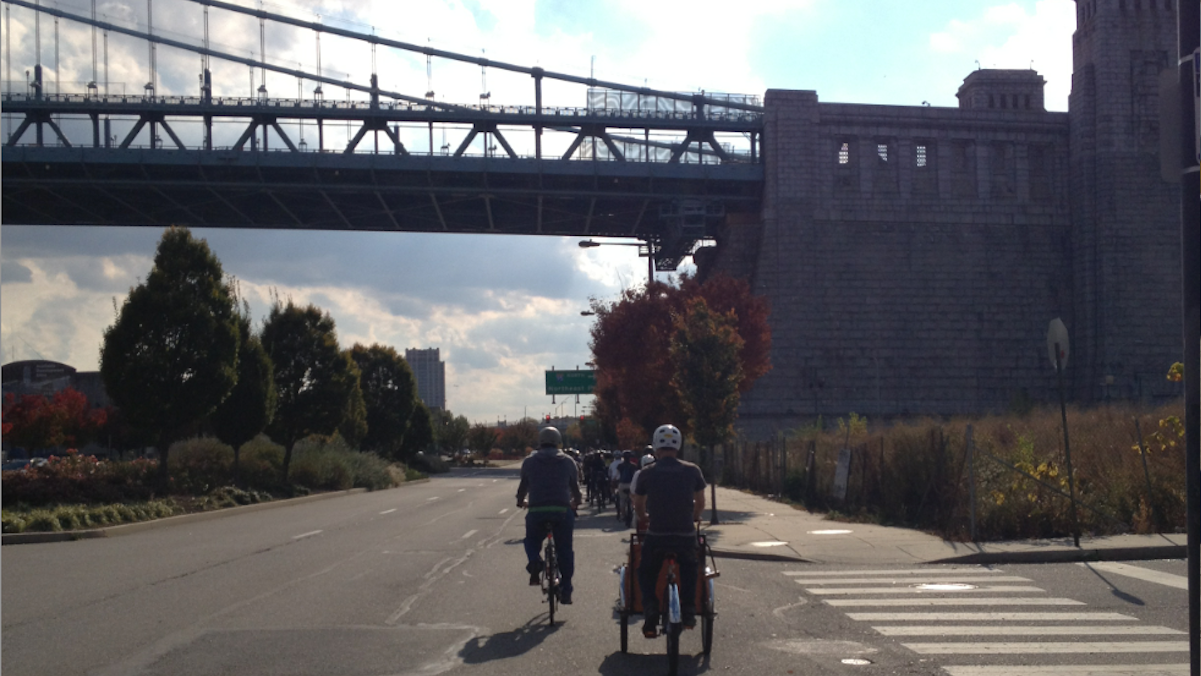  Bicyclists riding on Delaware Avenue's unprotected bike lane. (Dena Driscoll/for NewsWorks) 