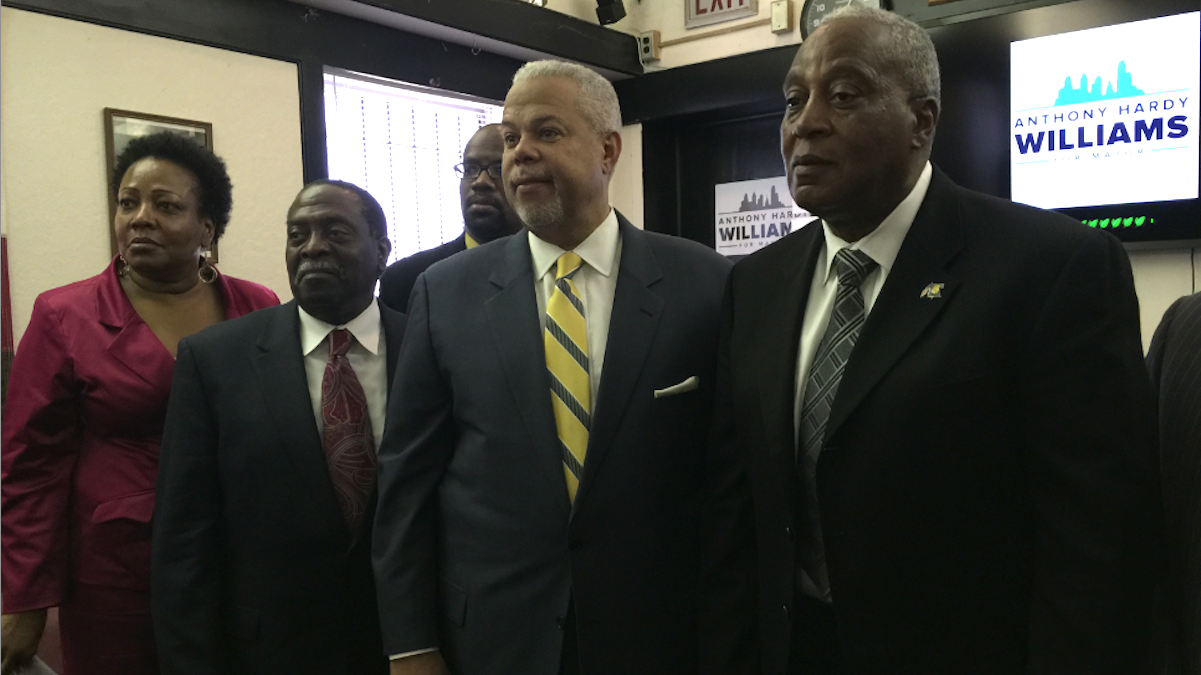 Mayoral candidate Anthony Hardy Williams accepts the Guardian Civic League endorsement, flanked by group president Rochelle Bilal, former Fire Commissioner Lloyd Ayers and former Police Commissioner Sylvester Johnson. (Brian Hickey/WHYY) 
