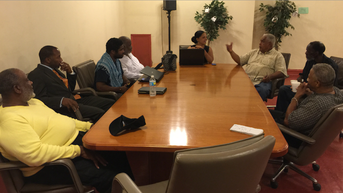  A group of faith leaders, and Milton Street, formalize plans for their Wednesday protest at City Hall. (Brian Hickey/WHYY) 