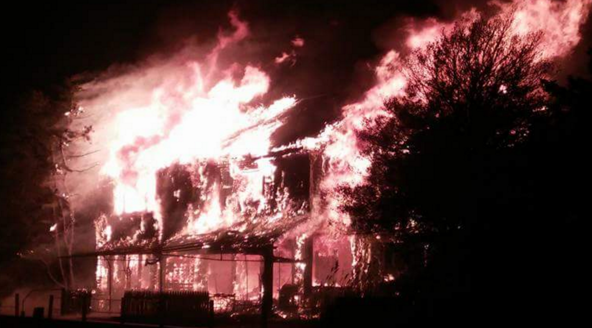 A house engulfed in flames on Channel Lane in Mantoloking Saturday evening. (Photo: Bruce Roland via @wt2fd via Twitter)