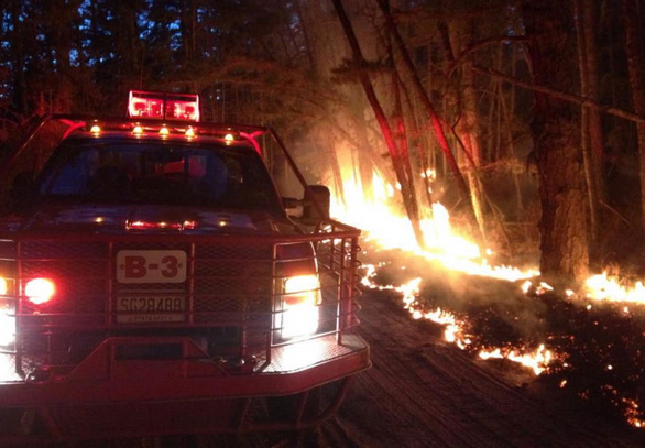  A New Jersey Forest Fire Service truck on the sceneof the 'Devious Mount' wildfire in Wharton State Forest in early April 2014. Crews contained the forest fire, which consumed 1,600 acres in a remote area, within approximately 24 hours.  