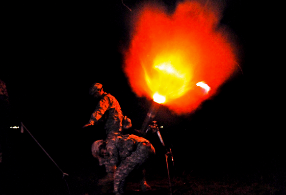  Soldiers fire a round from a 120mm illumination mortar system during a night training mission on Camp Santiago Joint Maneuver Training Center in Salinas, Puerto Rico, on July 14, 2013. (Photo: U.S. Army Staff Sgt. Joseph Rivera Rebolledo) 