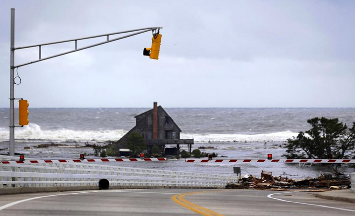  A lone home stood near the Mantoloking Bridge in Mantoloking after Superstorm Sandy's storm surge inundated the area in late October 2012. (Photo: Associated Press) 