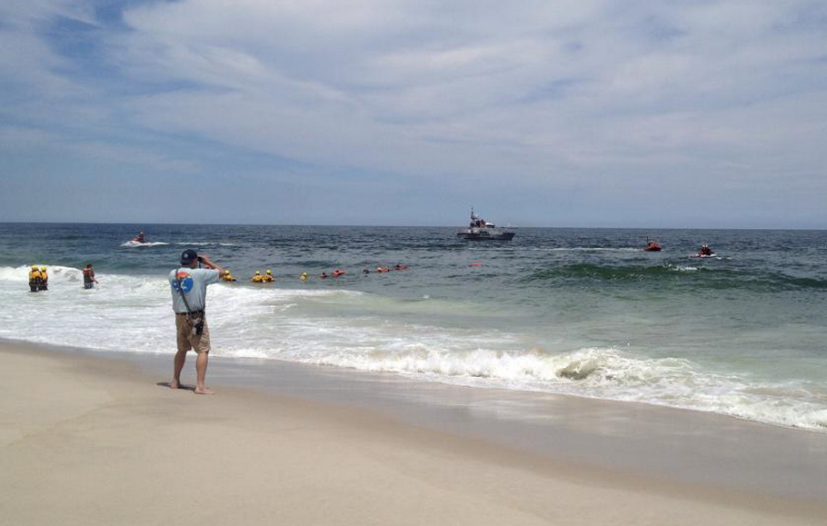  Water rescue crews searching for a missing swimmer off Island Beach State Park Friday afternoon. (Photo: JSHN contributor Amanda Barton) 