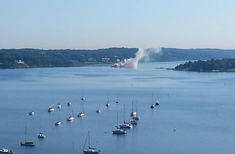  Smoke rising from a barge in the Navesink River Monday morning. (Photo: JSHN contributor Donna Grewe Cuming‎) 