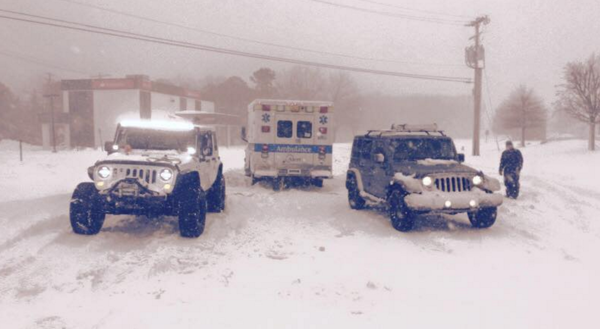  Two Jersey Shore Jeepers club members assisting a stuck ambulance during last week's blizzard. (Photo courtesy of Jersey Shore Jeepers) 