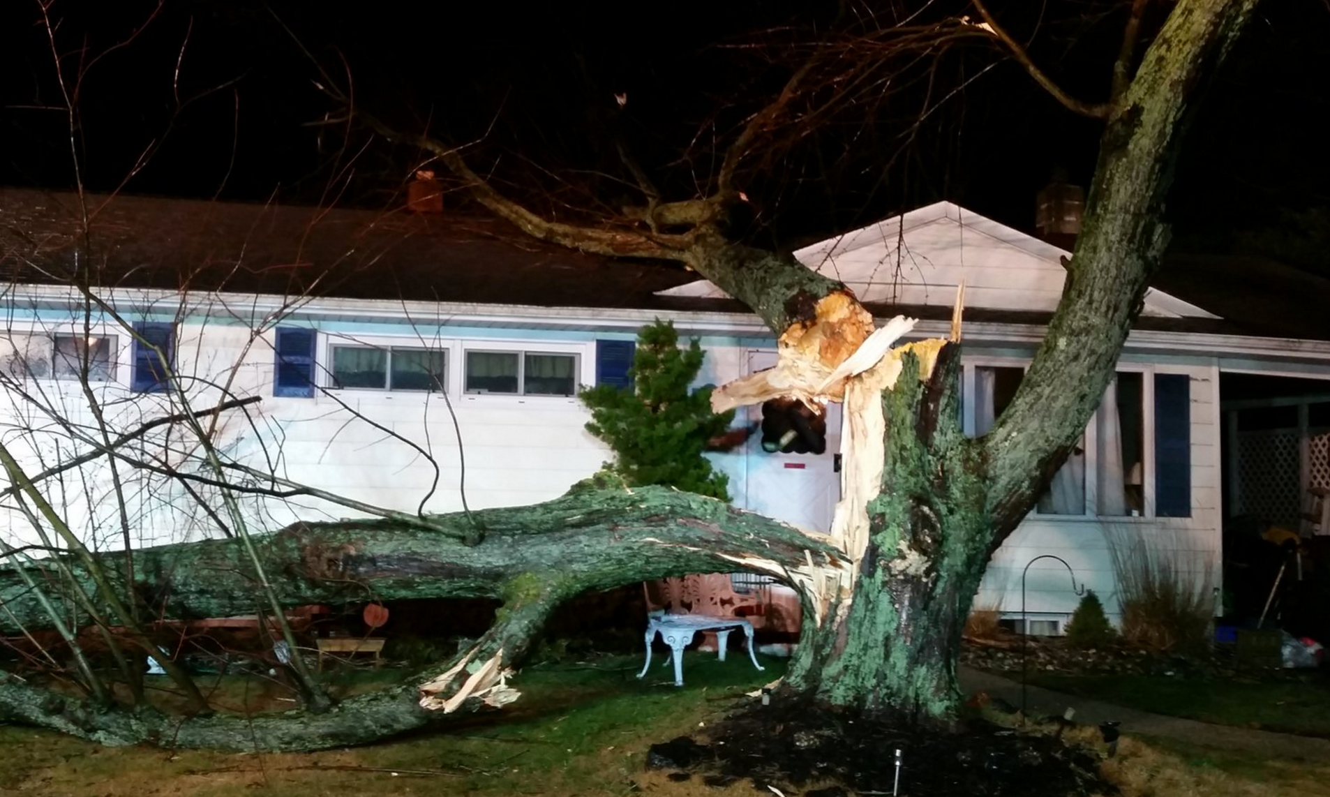 A large tree branch fell on a Neptune house this evening. (Photo courtesy of the Neptune Police Department)