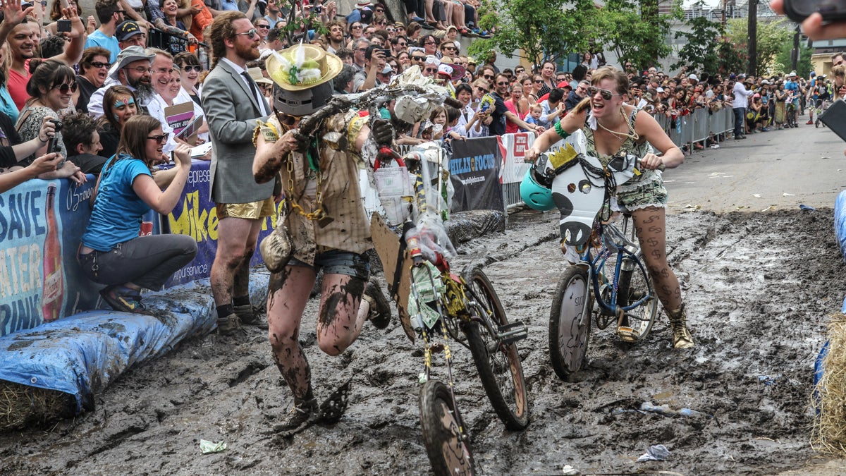 The Kensington Kinetic Sculpture Derby participants attempt to ride through the mud pit at the end of the parade. (Kimberly Paynter/WHYY)