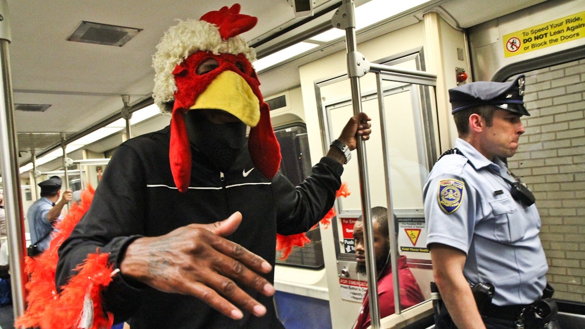  'Chicken man' freestyles to honor SEPTA's new late night train service. (Kimberly Paynter/WHYY) 