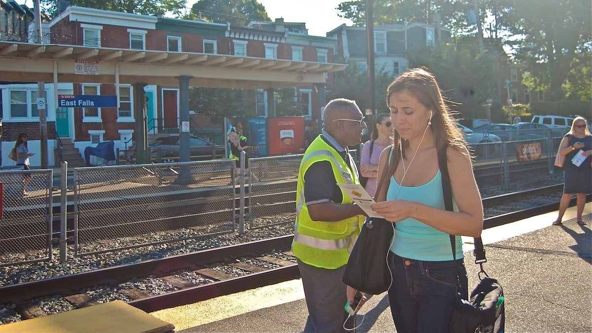  SEPTA safety officers handing out information to commuters on Thursday morning. (Emily Brooks/for NewsWorks) 