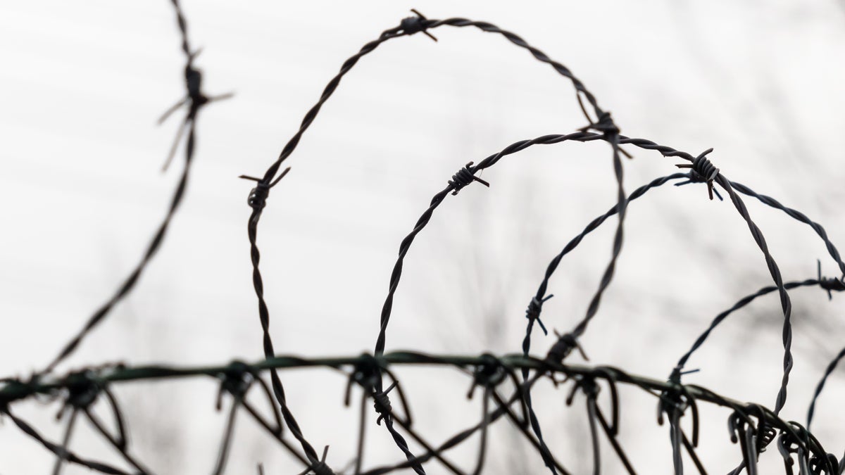 (<a href='http://www.shutterstock.com/pic-171287141/stock-photo-a-fence-is-secured-with-barbed-wire-symbolic-photo-for-security-prison-and-crime.html'>Barbed wire</a> image courtesy of Shutterstiock.com) 