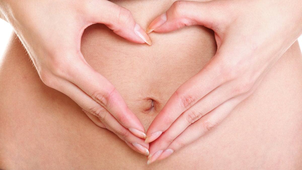  (<a href='http://www.shutterstock.com/pic-130889957/stock-photo-sexy-young-woman-making-heart-shape-with-her-hands-on-her-belly.html'>Belly</a> image courtesy of Shutterstock.com) 