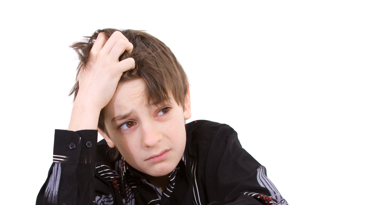  (<a href='http://www.shutterstock.com/pic-24702862/stock-photo-child-with-study-of-the-difficulties-on-white-background.html'>Child under stress</a> image courtesy  of Shutterstock.com) 