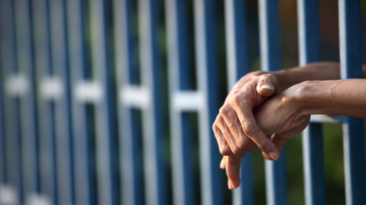  (<a href='http://www.shutterstock.com/pic-174659255/stock-photo-hand-in-jail.html'>Hands behind bars</a> image courtesy of Shutterstock.com) 