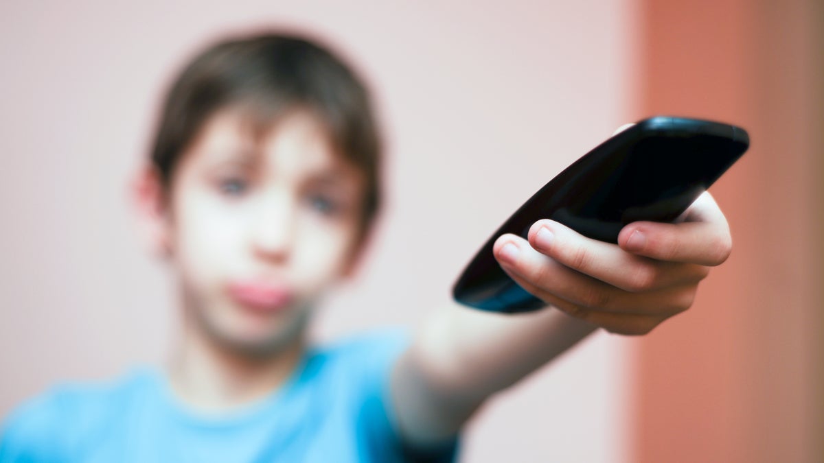 Boy with remote control (image courtesy of Shutterstock.com)