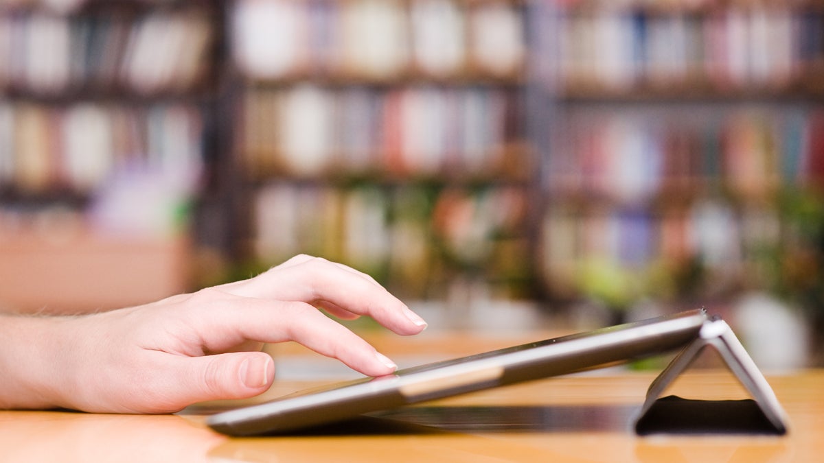  (<a href='http://www.shutterstock.com/pic-172423823/stock-photo-hands-typing-on-tablet-computer-in-library.html'>Modern library image</a> courtesy of Shutterstock.com) 