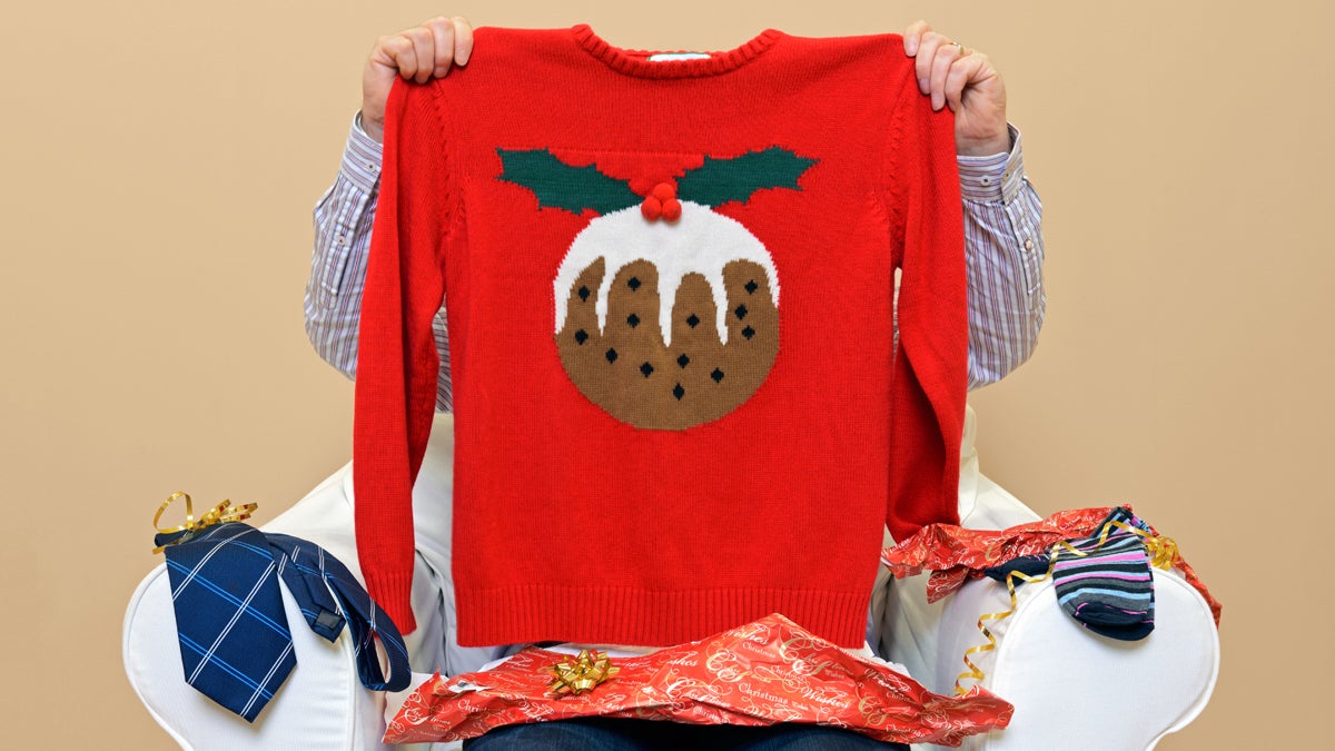  (<a href='http://www.shutterstock.com/pic-165510479/stock-photo-a-man-opening-christmas-presents-to-discover-he-got-a-christmas-themed-jumper-to-go-along-with-the.html'>Ugly sweater</a> image courtesy of Shutterstock.com) 