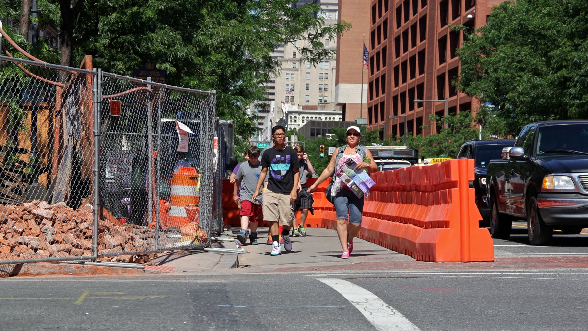  Demolition at Third and Market streets drives pedestrians into traffic lanes. (Emma Lee/WHYY) 