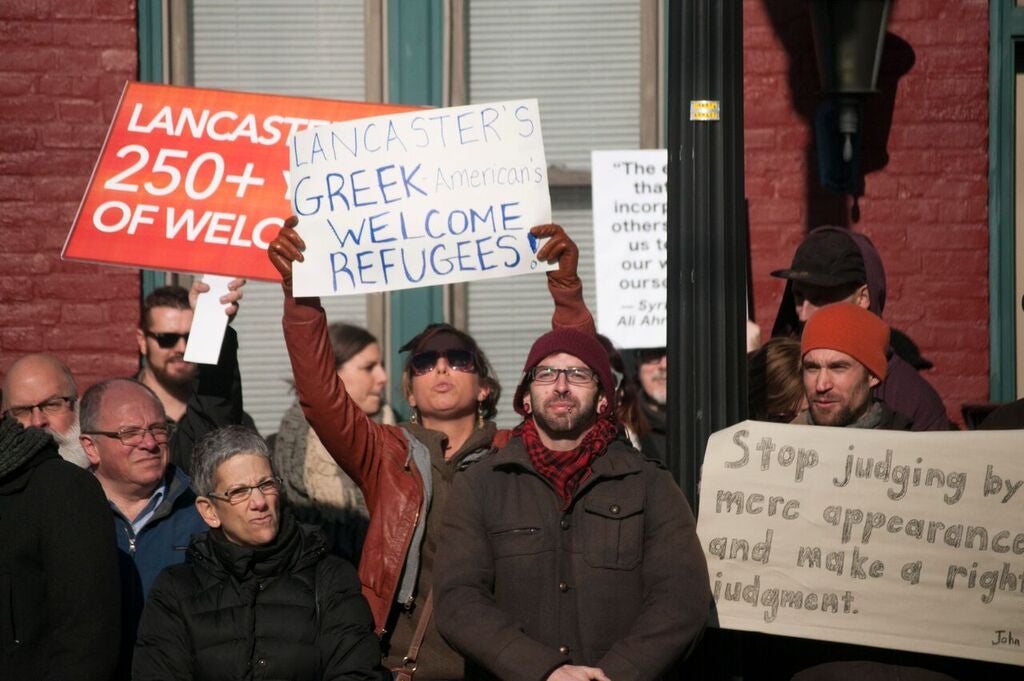  About 250 people demonstrated in support of refugee resettlement as a counter to a protest staged outside Church World Service's office in Lancaster. (Diana Robinson/WITF) 