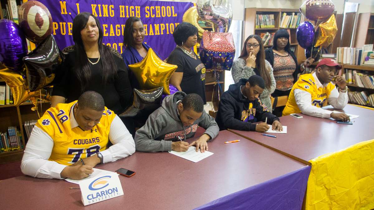  MLK High School football players on National Signing Day. (Brad Larrison/for NewsWorks) 