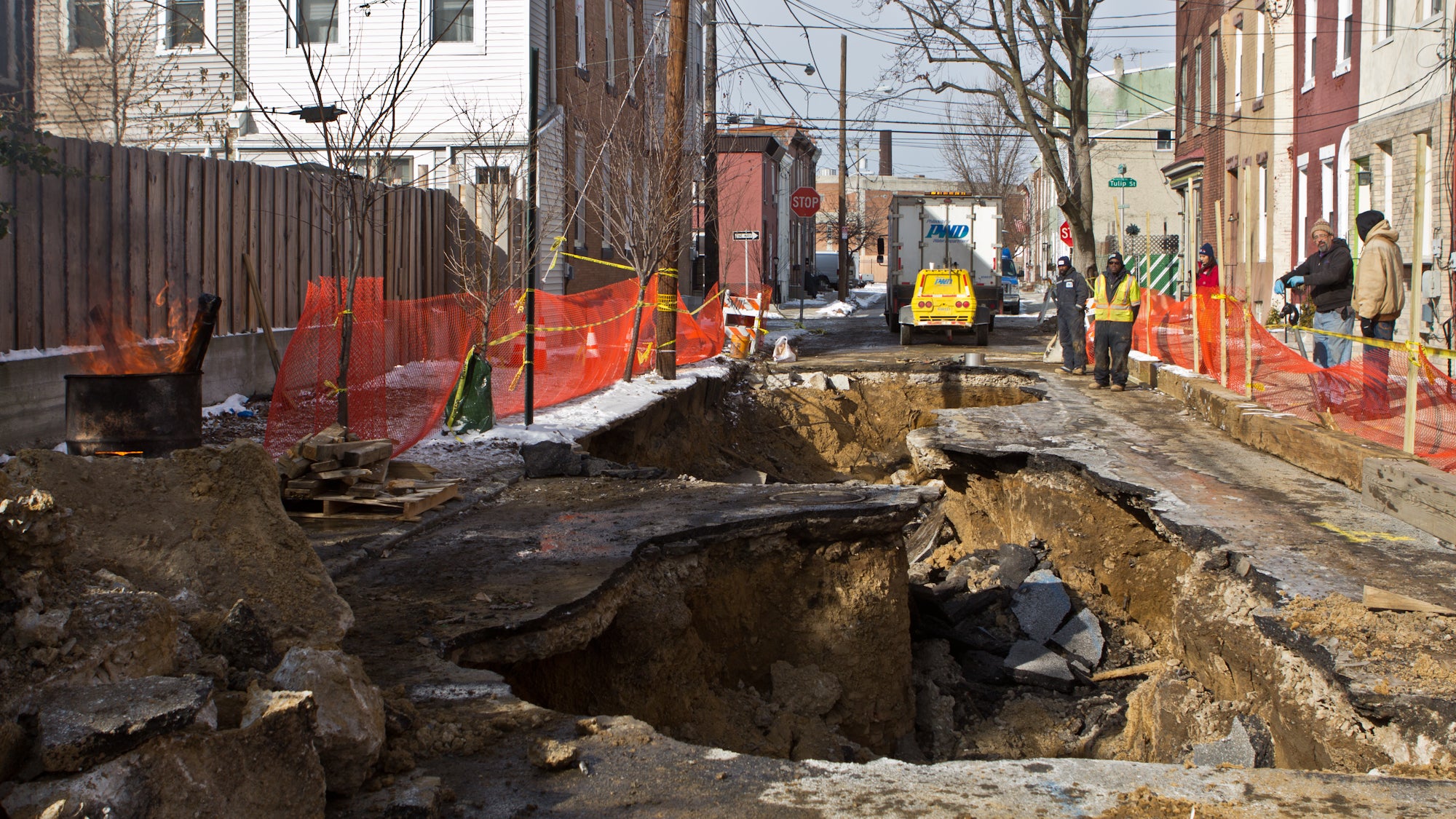 A sinkhole is under repair at the 2300 block of East Boston Street. (Kimberly Paynter/WHYY)