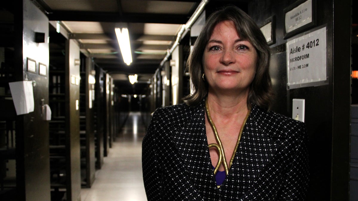  Siobhan Reardon, president and director of the Free Public Library, stands amid the rows of unused stacks at the Central Library that will be transformed into public space using a $25 million grant from the William Penn Foundation. (Emma Lee/WHYY) 