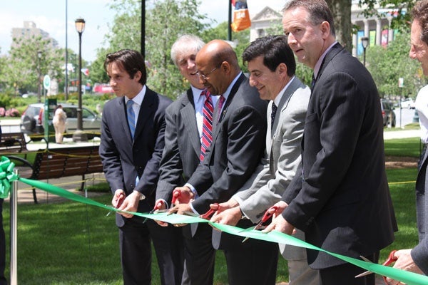  Mayor Michael Nutter (center) cuts the ribbon on Sister Cities Park. (Emma Jacobs/WHYY) 