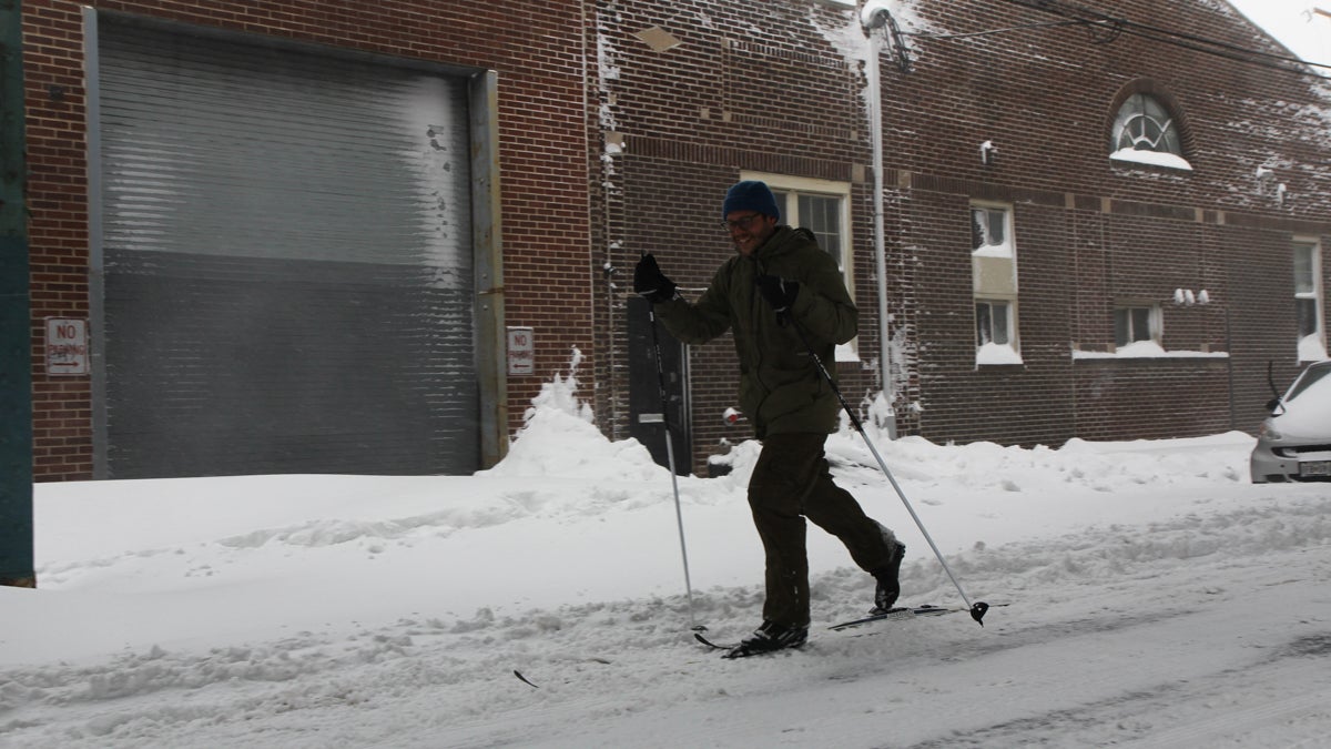 A man uses cross country skis to get around on Front Street Saturday afternoon. (Kimberly Paynter/WHYY)