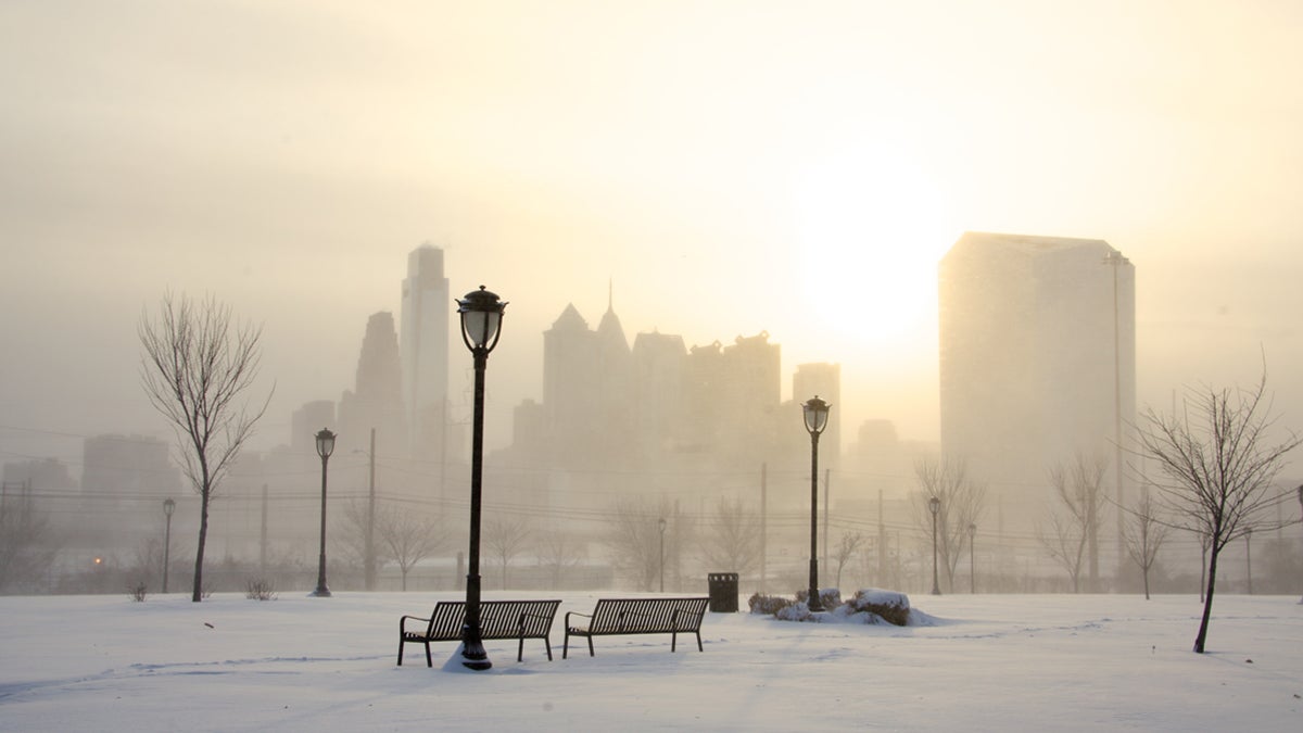  The Philadelphia skyline is faintly seen in the distance from Drexel Park due to high winds blowing fallen snow. (Nathaniel Hamilton/for NewsWorks) 