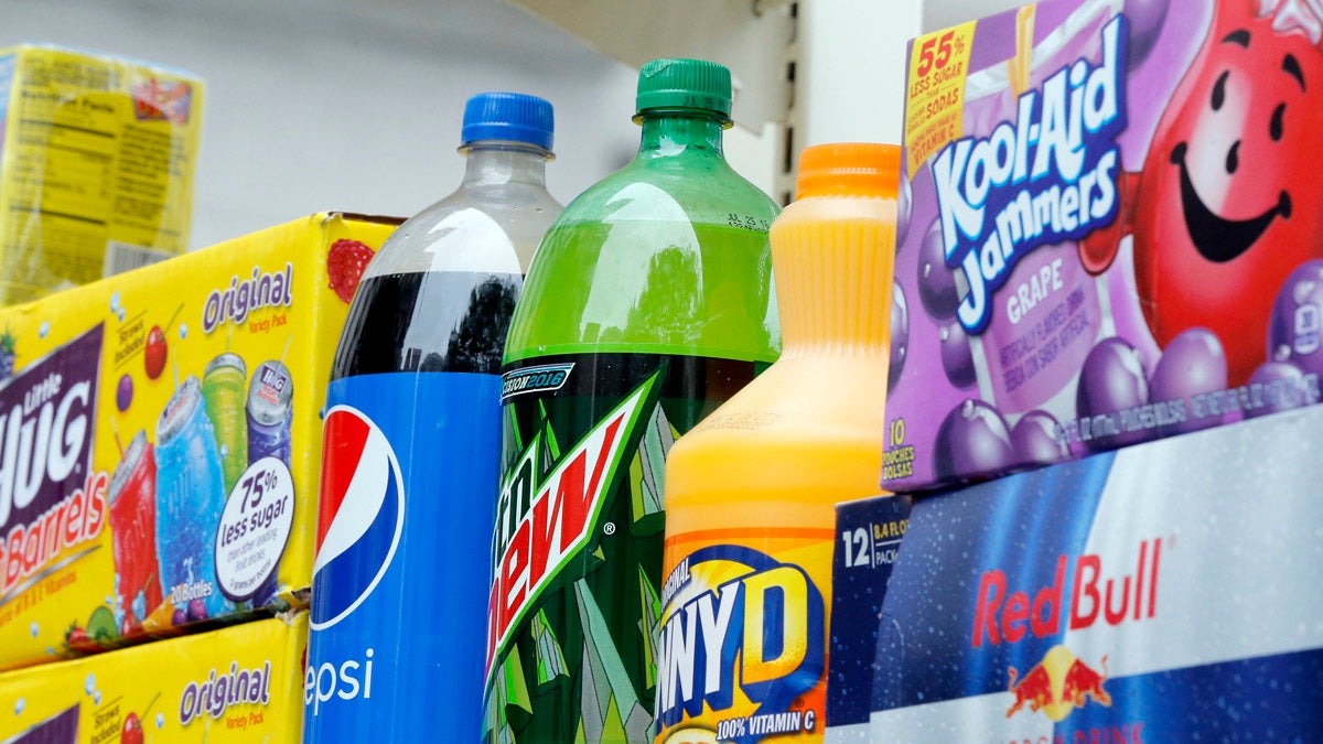 A delivery truck outside Independence Visitor Center on Sixth Street carries an ad against Philadelphia's proposed sugary drink tax. (Katie Colaneri/WHYY)