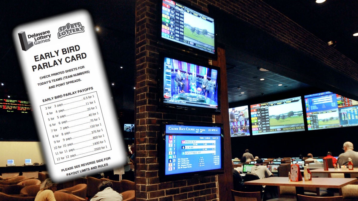 Bettors watch horse races at the sports book parlor at Dover Downs casino in Dover. (AP Photo/ Steve Ruark) 