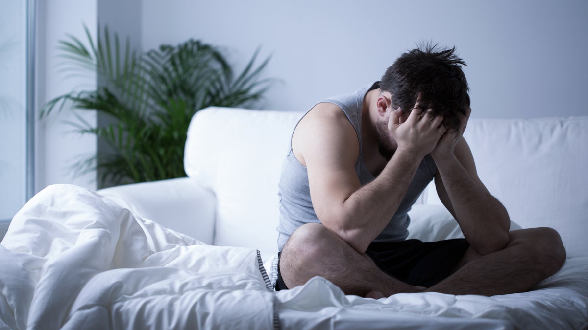  (<a href=“http://www.shutterstock.com/pic-258931763/stock-photo-young-man-having-depression-sitting-on-the-bed.html?src=hxB1t-ozDZWbDqkIqnGFvQ-1-7”>Photo</a> via ShutterStock) 