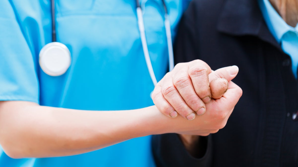  (<a href=“http://www.shutterstock.com/pic-140404582/stock-photo-caring-nurse-or-doctor-holding-elderly-lady-s-hand-with-care.html?src=GnTfmErksevvrgEh3ib39A-1-1”>Photo</a> via ShutterStock) 