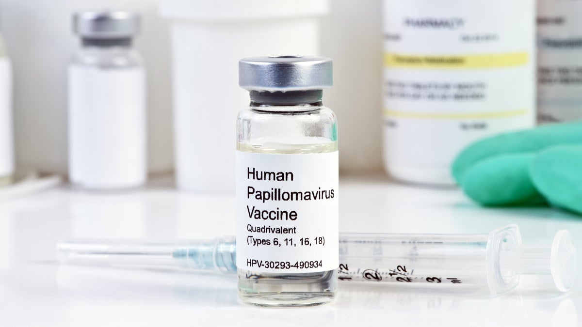  (<a href=“http://www.shutterstock.com/pic-237242650/stock-photo-human-papilloma-virus-vaccine-with-syringe-in-vial-at-a-clinic.html?src=RjDGz4Xy8klyjLlj_Y2n-A-1-0
