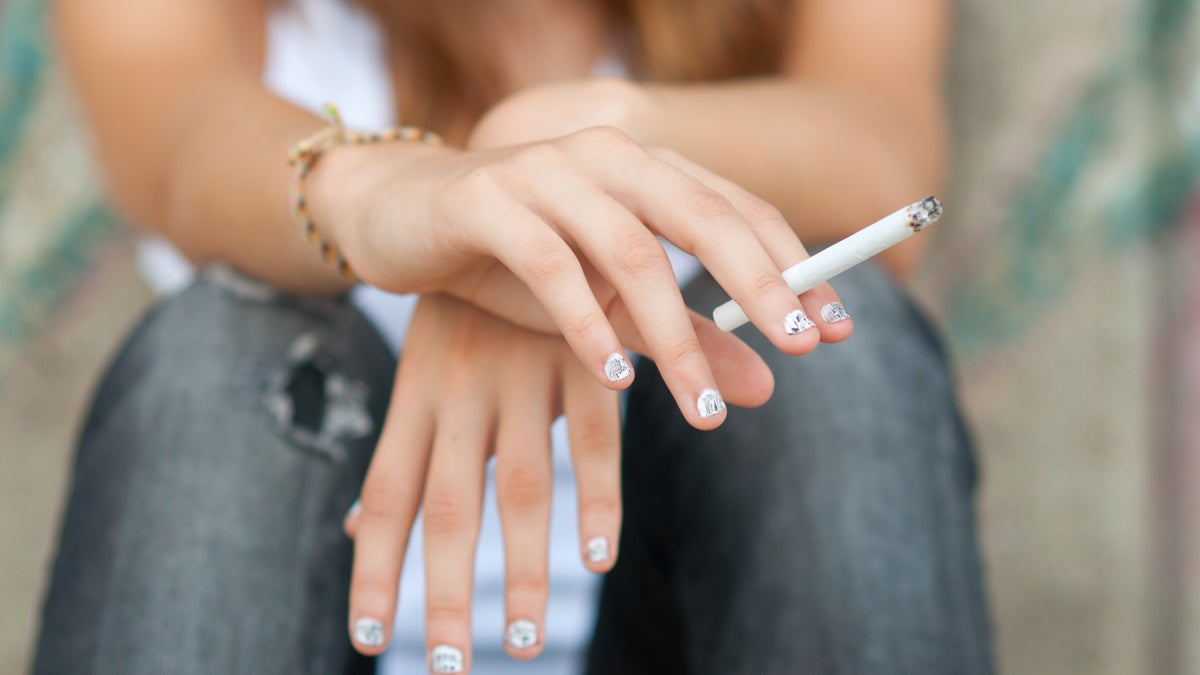  (<a href=“http://www.shutterstock.com/pic-108900479/stock-photo-teenage-hands-holding-cigarette.html?src=PdDKdmxZqycLiRiu00v8uw-1-1”>Photo</a> via ShutterStock) 