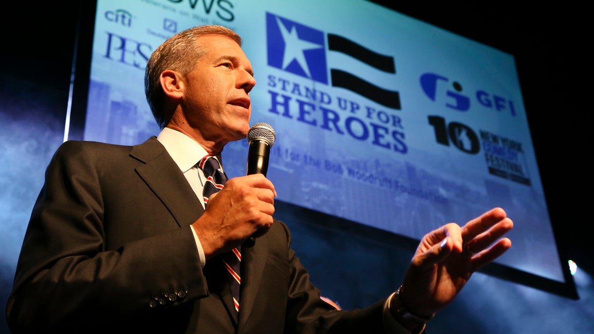  NBC News anchor Brian Williams speaks to the audience at the Stand Up for Heroes event at Madison Square Garden in 2013. (John Minchillo/InvisionAP) 