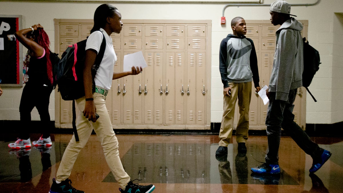  Students check in as they arrive at a new high school called The LINC, which stands for Learning in New Contexts in Philadelphia. (AP Photo/Matt Rourke) 