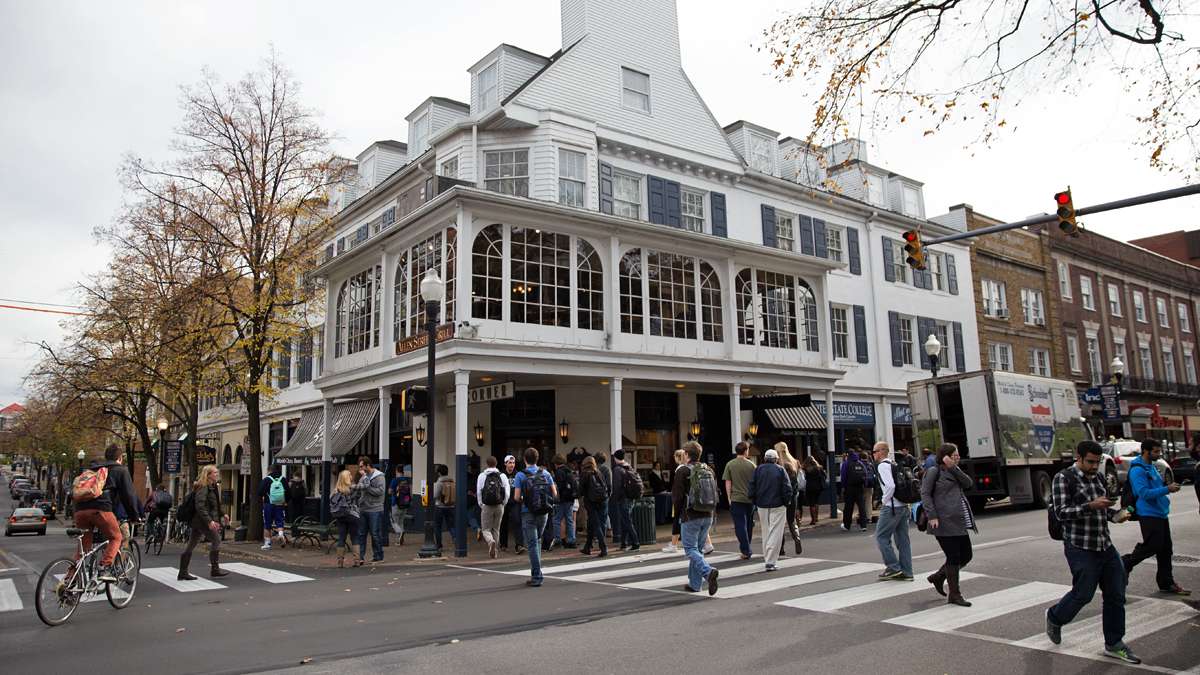 Pedestrians cross in front of The Corner Room at the intersection of College Avenue and S. Allen Street steps away from Penn State campus. (Lindsay Lazarski/WHYY)