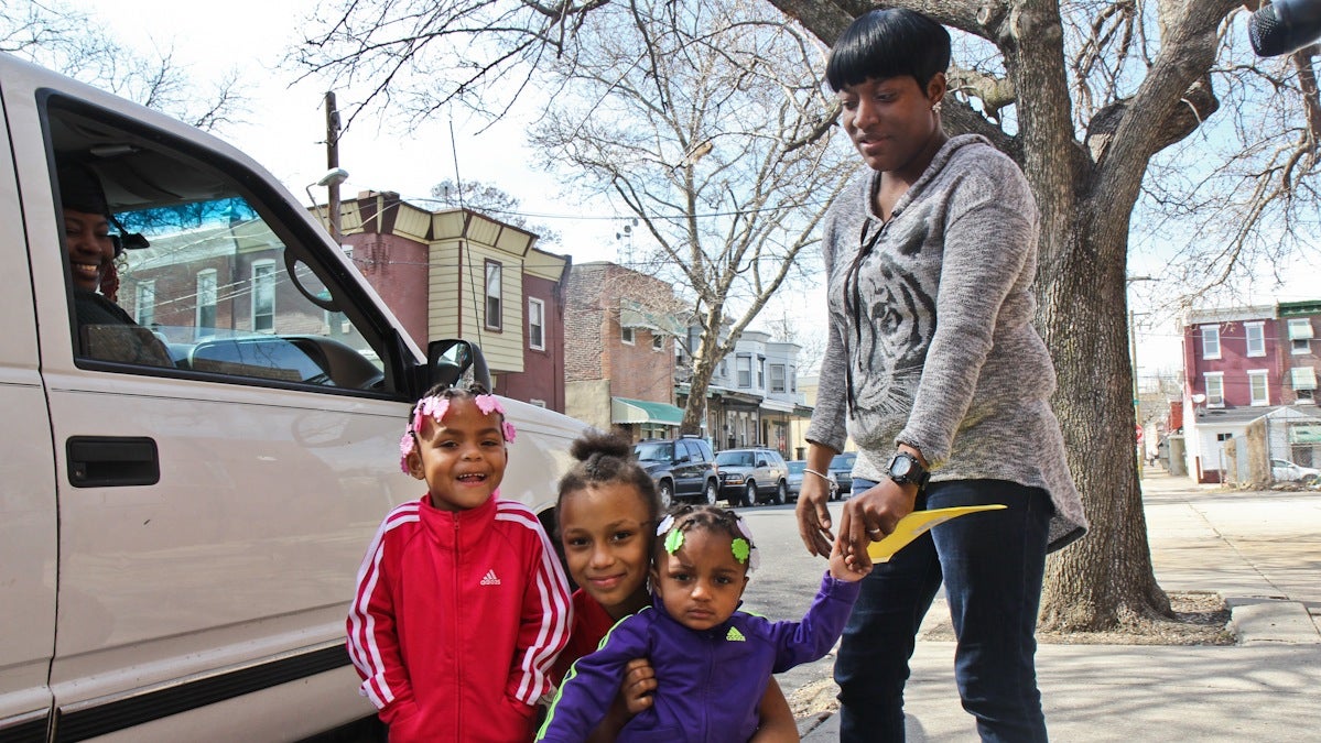  Tara Magras and her daughters Anyssar, pre-K; Anwar, kindergarten; and Amirrah, third grade; live around the corner from Steel elementary. (Kimberly Paynter/WHYY) 