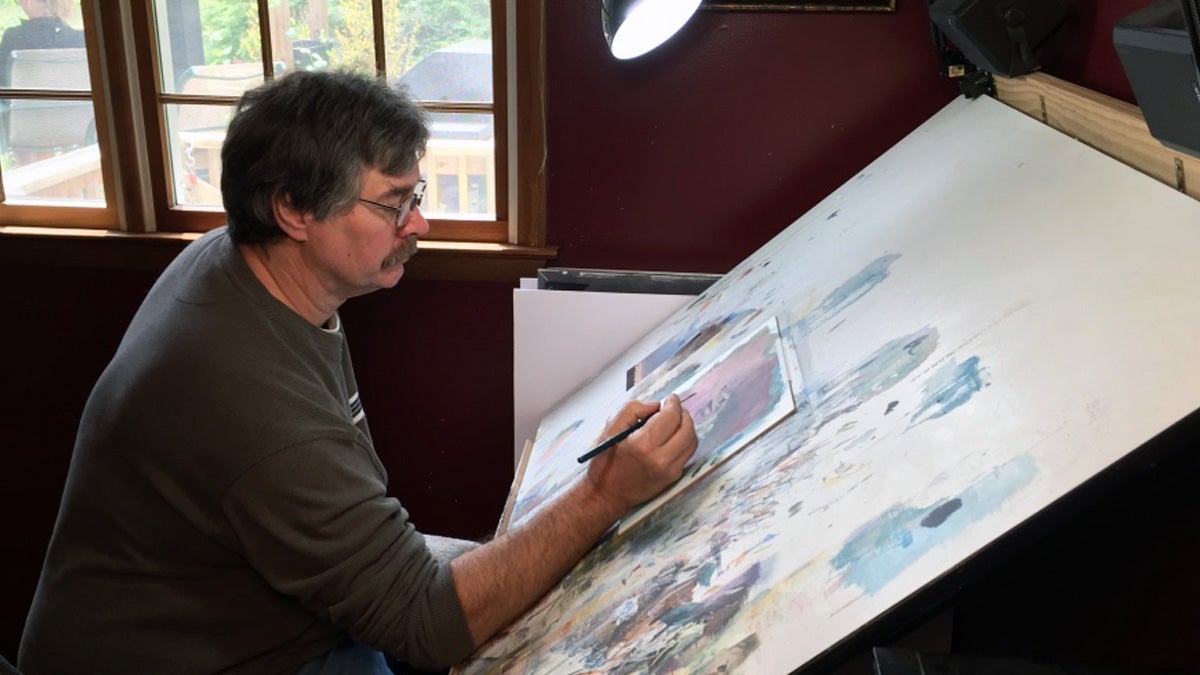 Artist Steve Oliver at work in his Delaware studio (Brian Drouin/NewsWorks)