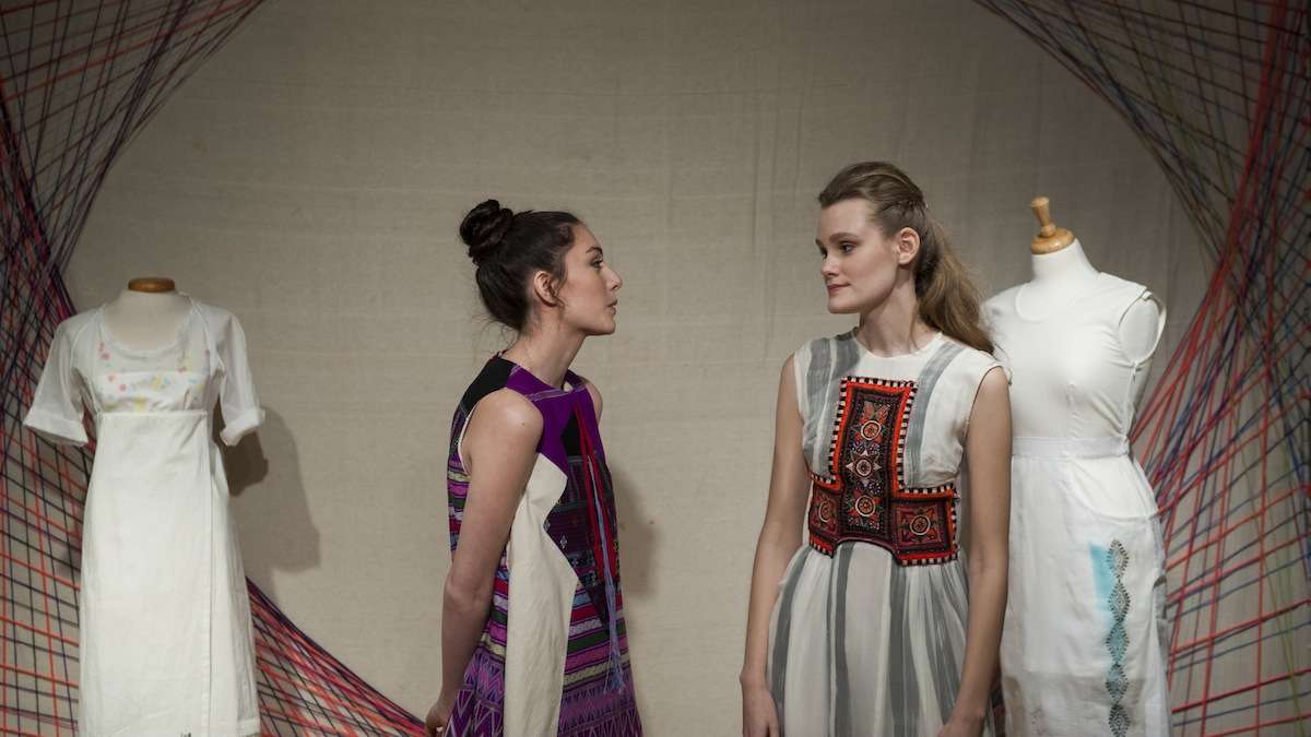  Models Lizzie Norton (left) and Alex Rader chat while wearing designs by Senpai , Kohai at the Style Social and Fashion Designer Launch party in Manayunk Wednesday evening. (Tracie Van Auken/for NewsWorks) 