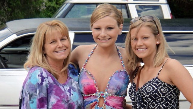  (From left) Carolyn Coburn with her daughters Samantha and Megan, before prom Samantha's sophomore year of high school. Samantha took her own life a year ago. Carolyn and Megan have formed an organization, 'Spread the Love,' to combat teen suicide. (Image courtesy of Megan Coburn) 