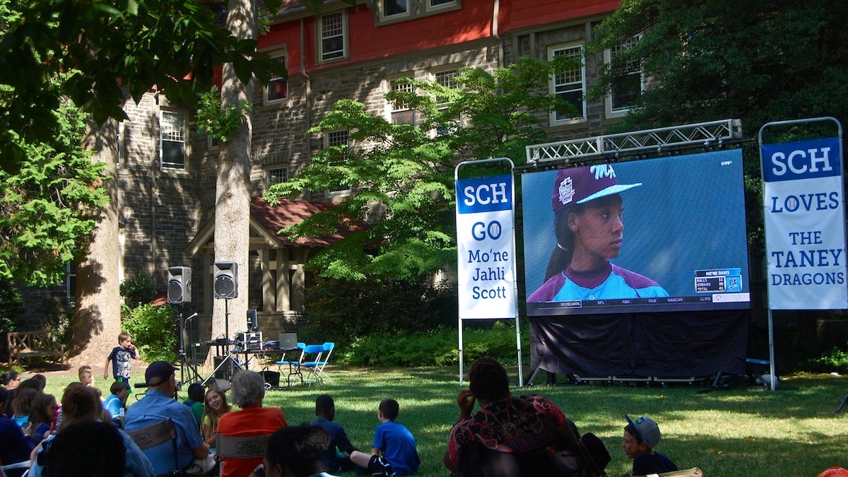  SCH Academy student Mo'ne Davis appears on the big screen at the school's watch party on Sunday. (Emily Brooks/for NewsWorks) 