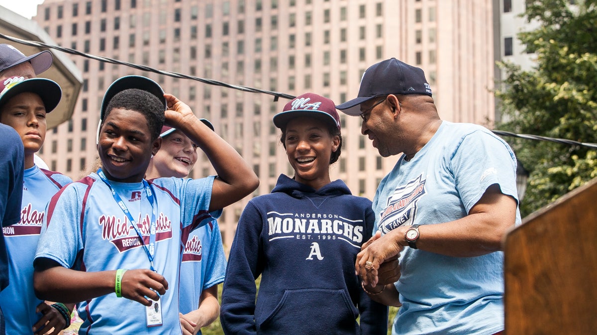 Pitcher Mo'ne Davis and her teammates laugh while chatting with Mayor Michael Nutter. (Brad larrison/for NewsWorks)