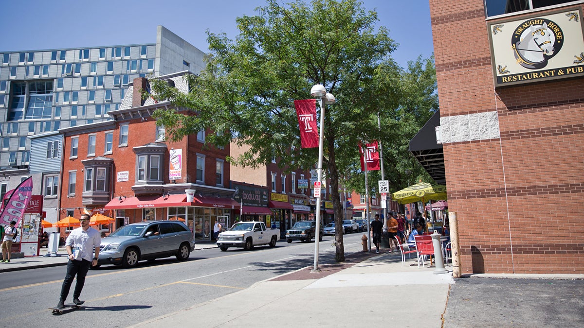  Temple University students, new student housing units, and restaurants occupy the heavily trafficked block on Cecil B. Moore Avenue just west of Broad Street. (Lindsay Lazarski/WHYY) 