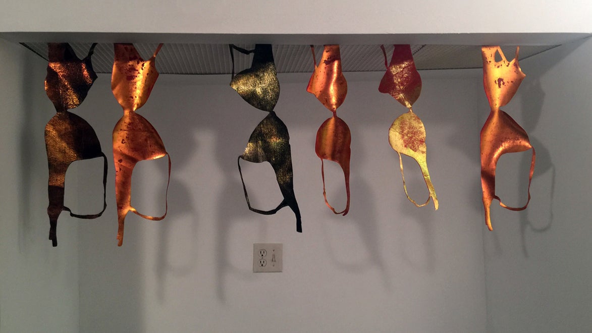  An installation by the collective Napoleon, featuring bronzed bras by Leslie Friedman. (Image courtesy of Tiger Strikes Asteroid)  