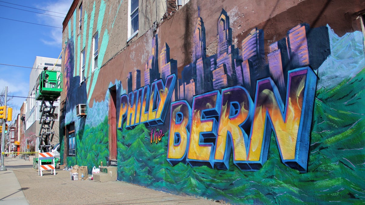 A mural going up at the corner of 22nd and Catherine streets promotes Democratic presidential candidate Bernie Sanders. (Emma Lee/WHYY)
